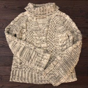 Jennifer Lopez Cut Out Cable Knit Turtleneck